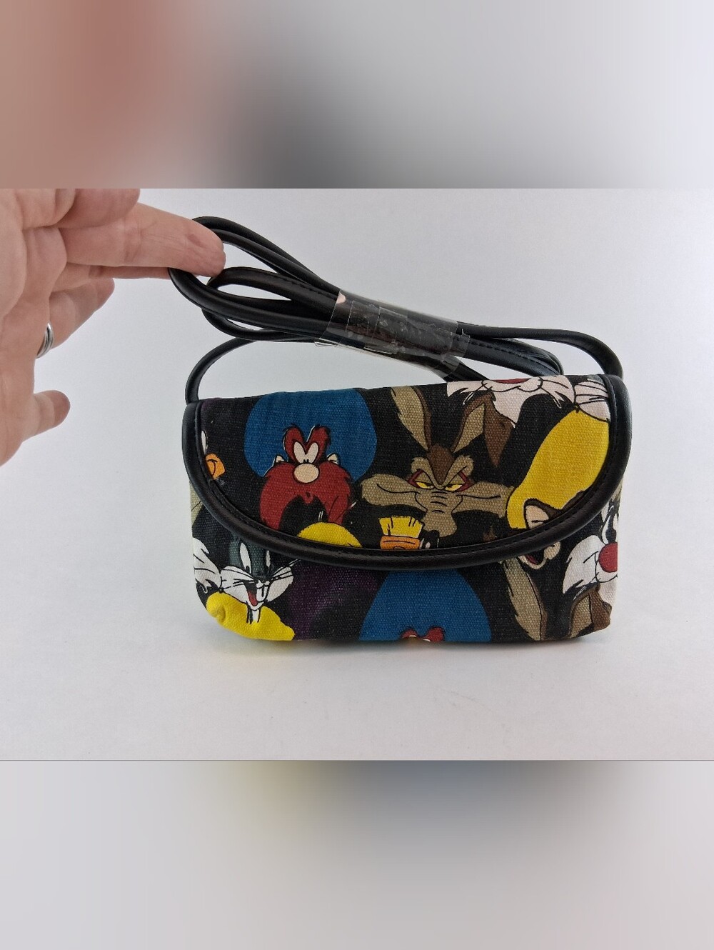 Vtg. Warner Bros. Black Crossbody with Colorful Looney Tunes Faces